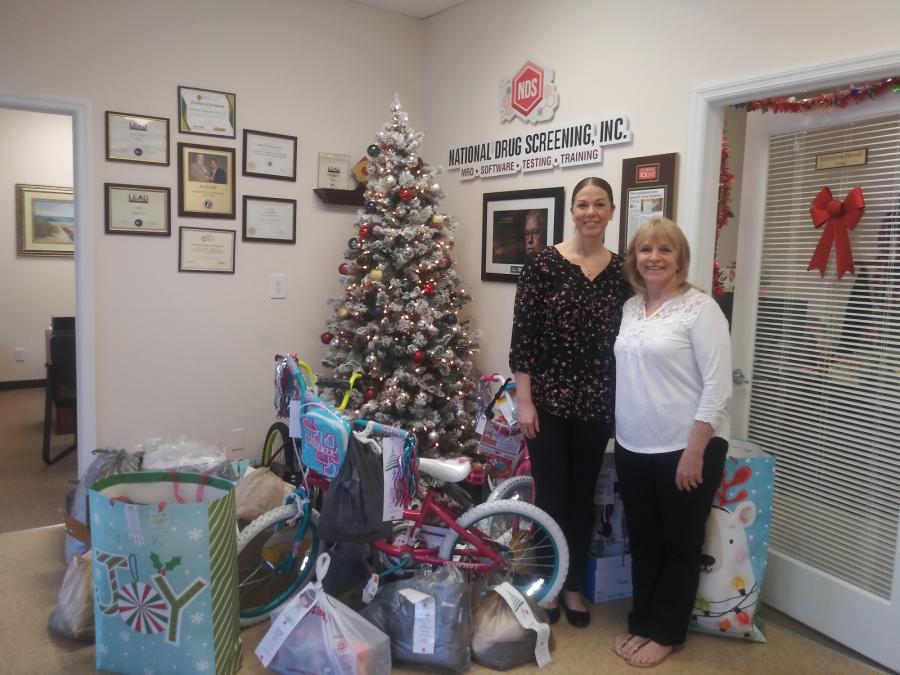 Julie Floriano and Shannon Kikendall coordinator of the NDS Christmas Giving Team
