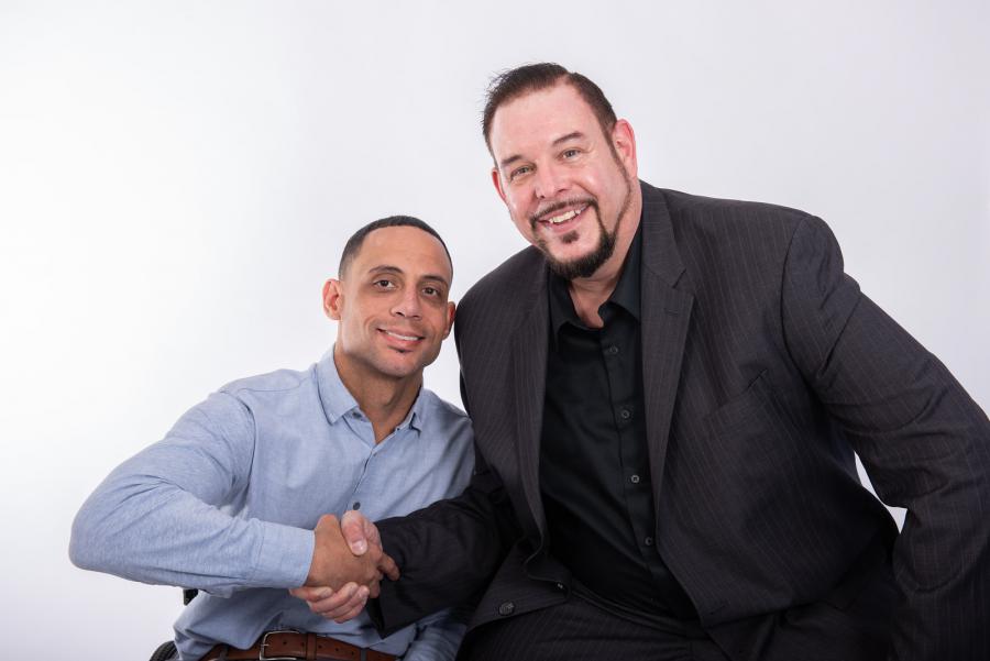 Dominic Barber posing with Director of Marketing Michael Sanders