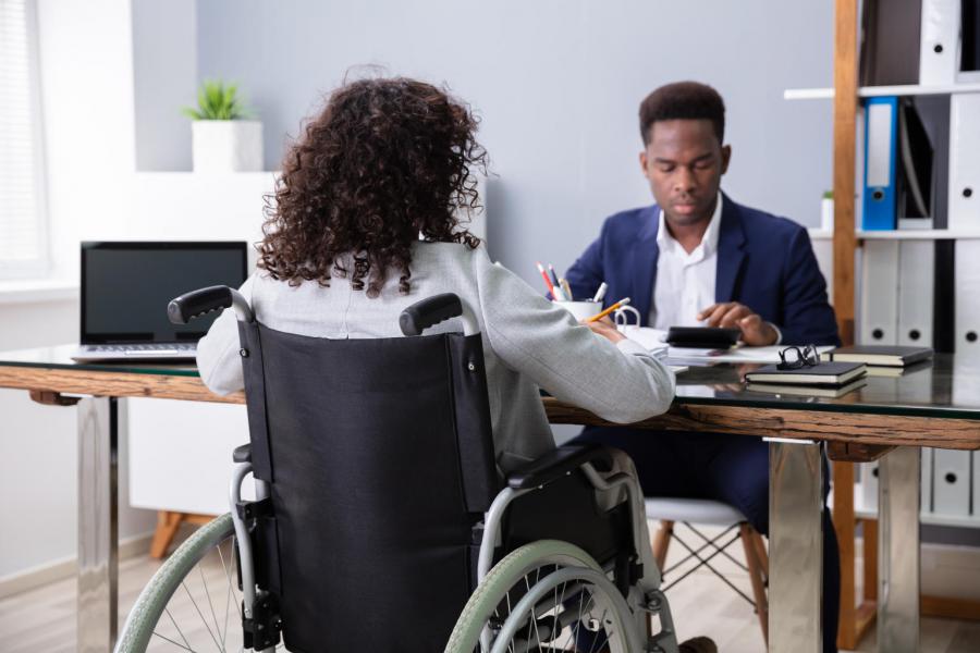 Woman in Wheelchair Being Interviewed for a Job