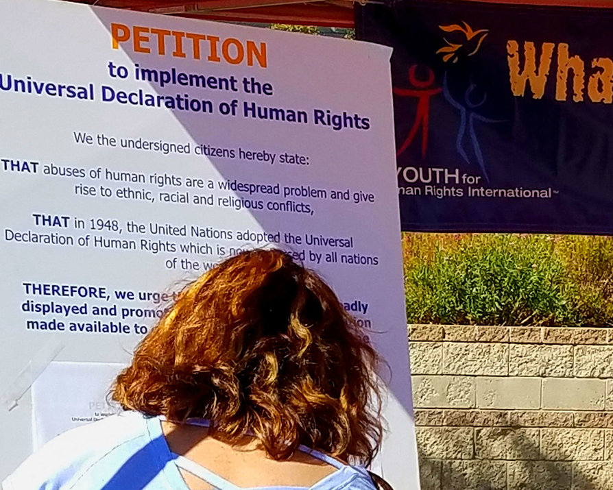 Visitors to the booth were invited to sign a petition to make it mandatory for all schools to provide human rights education to their students.