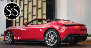 Red convertible Ferrari parked in front of Luxury Avenue Mall in Cancun