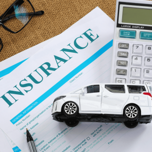 a person reviews the new automobile insurance policies in Ontario