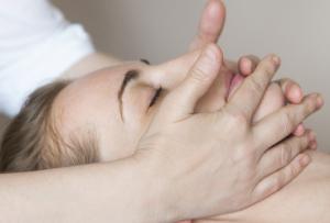 Woman receiving a lymphatic massage from a professional.