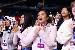 Young people react to Pope Leo at the National Catholic Youth Conference at Lucas Oil Stadium