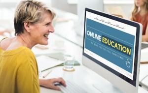 Person using an online education program on a computer, representing California’s growing adoption of DMV-approved online driver-education.