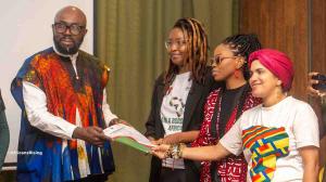 Delegates from High-Level Influencers Forum on Borderless Africa standing and handing the declaration to the African union