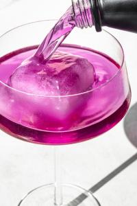 Passion Punch THC beverage bottle photographed on a table surface.