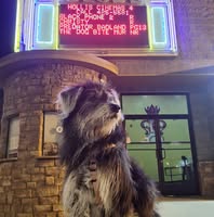 Pepper Anne posing in front of Hollis Cinemas