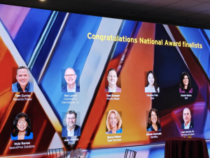 Digital display at the EY Strategic Growth Forum 2025 featuring the Entrepreneur Of The Year National Finalists, including Tom Currier of Maverick Power.