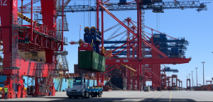 Waterside Operations: Autonomous Tractor Operating Under a Quay Crane