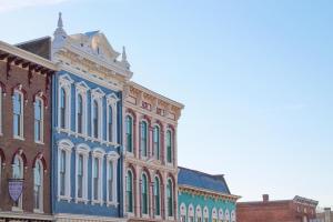 A sunny day of shopping in Downtown Georgetown, Kentucky with historic buildings outlining blue skies.