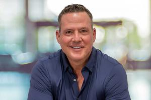 Digital display at the EY Strategic Growth Forum 2025 featuring the Entrepreneur Of The Year National Finalists, including Tom Currier of Maverick Power.