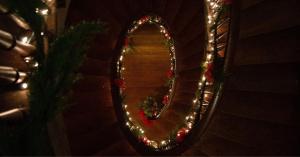 Holiday Lights illuminate the beautiful double helix spiral staircase at Ward Hall