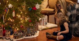 Family gathers around the Holiday decorations at Ward Hall