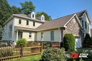 Fully restored stucco house at Four Seasons by ZD Stucco Repair