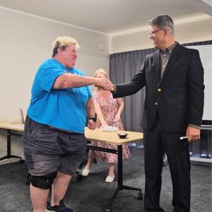 Dr. Ron Elli and Raffle Winner Penny