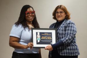 Natasha Broxton receiving the 2025 Wisconsin Exemplary Employer Award during the recognition ceremony.