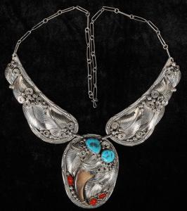 Vintage Navajo made bear claw, turquoise and coral necklace by Navajo silversmith J. Yazzie, well kept, appears to be from about the late 1960's / 1970's. Estimate: $1,400-$1,800.