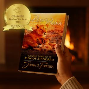 Rites of Passage book being held in front of warm fireplace with Book of the Year Winner seal