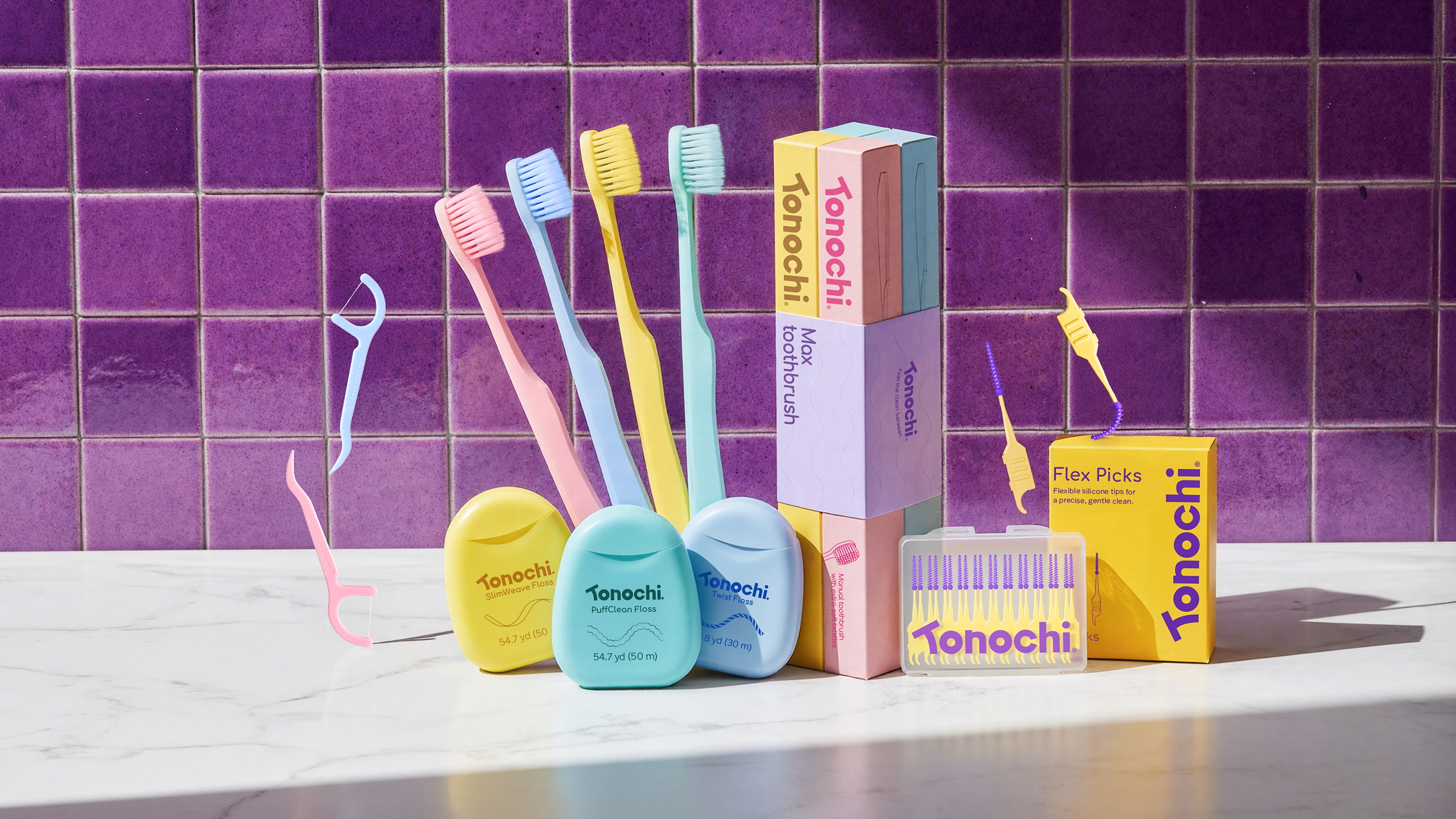 Tonochi pastel extra-soft toothbrushes, floss, and picks.