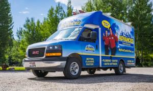 Advanced Home Services plumbing and HVAC service van parked outdoors.