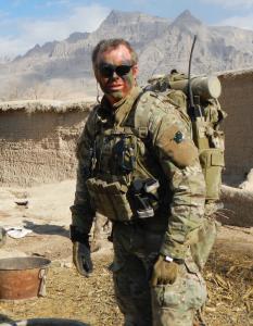 Dr Kieran McCarthy is standing in his uniform while working as a special operations doctor