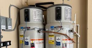 Two high-efficiency heat pump water heaters installed side-by-side by Super Brothers Plumbing Heating and Air during a Bay Area electrification upgrade project.