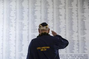 USS Arizona survivor Louis “Lou” Conter salutes the names of the fallen inscribed at the USS Arizona Memorial in this Dec. 7, 2014 photo. Conter, the last surviving crew member of the battleship, died April 1, 2024, at the age of 102. As the 84th annivers