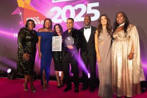 A group celebrates an award win