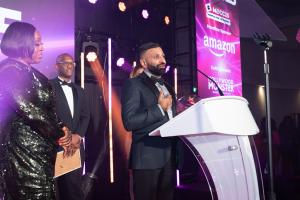 Smart businessman accepts award