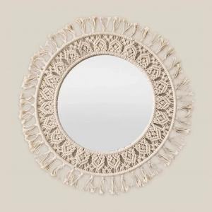 Macrame mirror with intricate knot design on wall