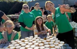 Grand Master Melodee Meyer and volunteer students from the Santa Barbara Dojo help assemble baskets for their 15th Annual Thanksgiving Basket Brigade