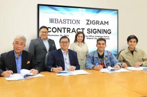 Team ZIGRAM and Team Bastion signing their partnership contract