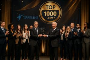 Executives and team from Treeline Inc., a leading sales recruiting firm, accept a Top 1000 Sales Recruiting Firm award on stage wih a celebratory gtroup applause.
