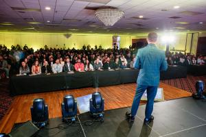 View from the stage showing Rony Jabour speaking to a full audience of 900 attendees at the Build Safe Connection 2025 Conference in Boston.