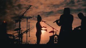 Silhouetted ANTENNAE framed by antennas, from the Moonscape immersive performances featured on NOMADslow.tv.