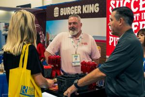 Attendees talking with franchise brands