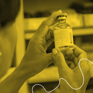 Pharmacist reviewing a vaccine product prior to providing clinical services.