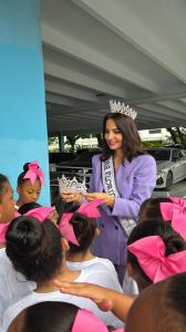 Miss Florida International Jessica Cristobal Show Embrace Girls her tiara During Girls Day Forum.