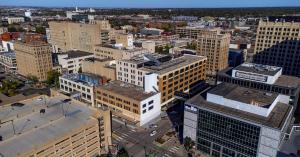 Aerial photograph of downtown Lincoln showing the Atrium Building at 1200 N Street, the new home of Elevator’s co-warehousing community.