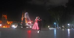 A screenshot from Romancing Sydney showing Waltz dancers around Archibald Fountain at Hyde Park