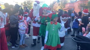 Santa Claus and Mrs. Santa Claus greeting the Los Angeles families as they usher them in to LATLC's 10th Annual Comfort & Joy, "A Miracle on 34th Street" at St. Patrick's Church