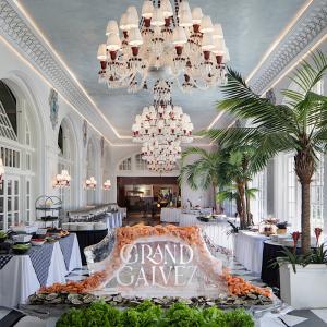 A hand-carved Grand Galvez ice sculpture with bountiful fresh seafood .