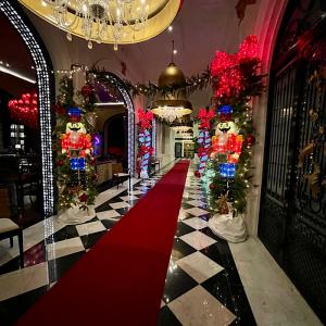 Peacock Alley at Grand Galvez features colorful Christmas decor including giant nutcrackers and colorful, embellished garland.
