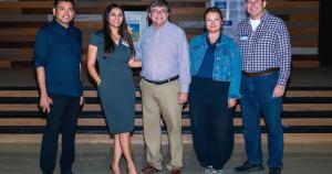 Five Central Texas civic and business leaders, including a real estate developer, a county commissioner candidate, and a city council member, standing together on stage at the Real Estate Forum (REF) Leander x Austin Chapter event.