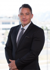 A professional image of Tai Tolman, Chief Revenue Officer at ASEA Global.