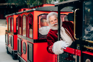 Santa driving the Northwoods Express train ride at SkyPark at Santa's Village.