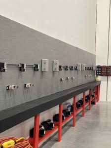 Photo of the back lab wall showing Starters, controls, and motors.