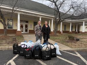 Jim and Mindi Parrish, with Annual Coat Drive Donation