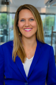 Professional headshot of Kristin Martin, Senior Managing Director of PLA, looking directly at the camera with a polished, approachable expression.